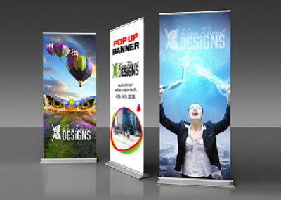 Retractable banners with creative design. Balloons with swimmer in flower field, electrifying person design and shapes to advertise pop up banners.